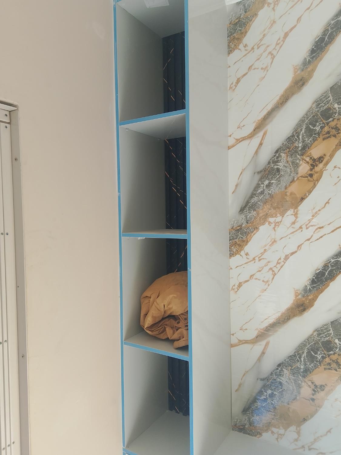 Gold linen column against marble